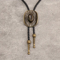 Coyboy Hat & Faux Leather Bolo Tie: Bronze Metal